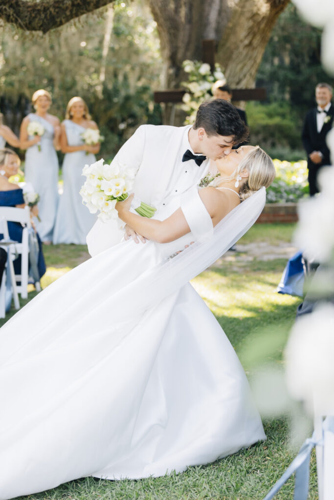 A dip first kiss at a plantation venue in Georgia during the ceremony. 